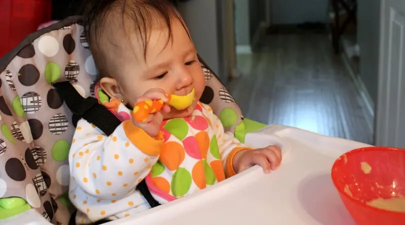 GIVING SOLID FOODS The progression of feeding solid foods to your baby. Starting at 4 to 6 months with purees, and working up to bite sized pieces by 7 months.