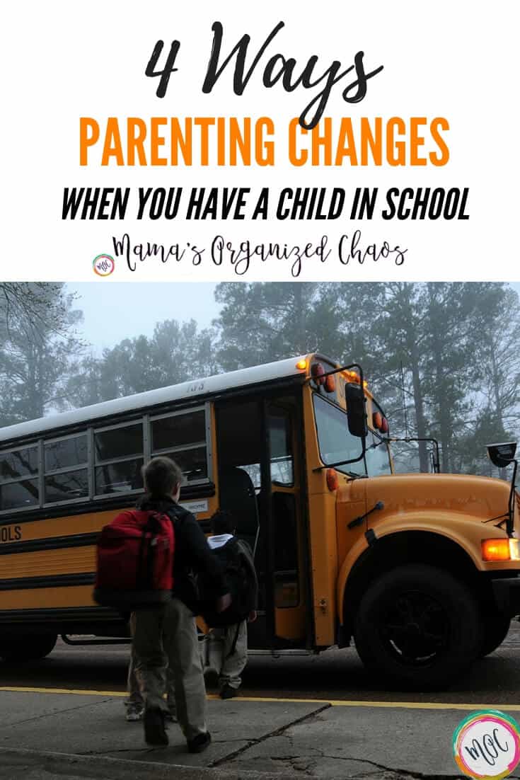 Children standing in line waiting to walk up the stairs of a school bus on a foggy morning. Parenting changes when you have kids in school. 