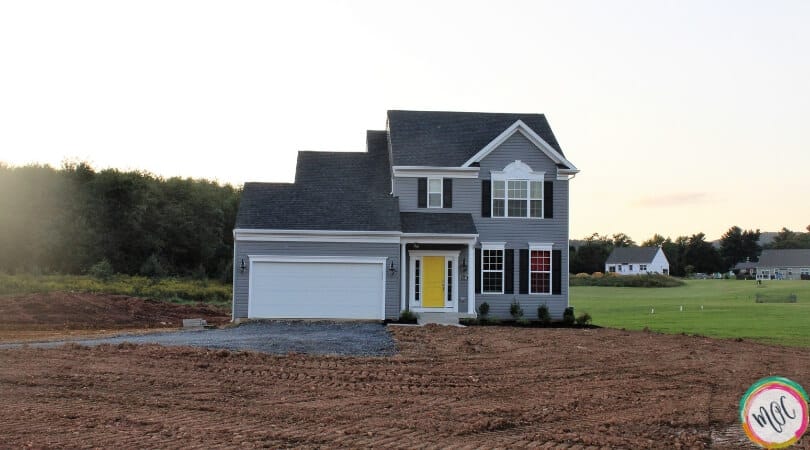 charcoal grey house with yellow door