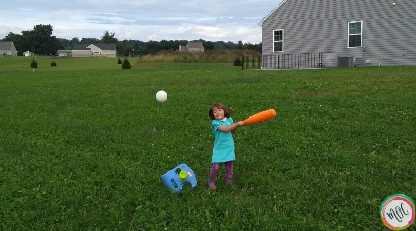 Caroline enjoying the outdoors playing t-ball