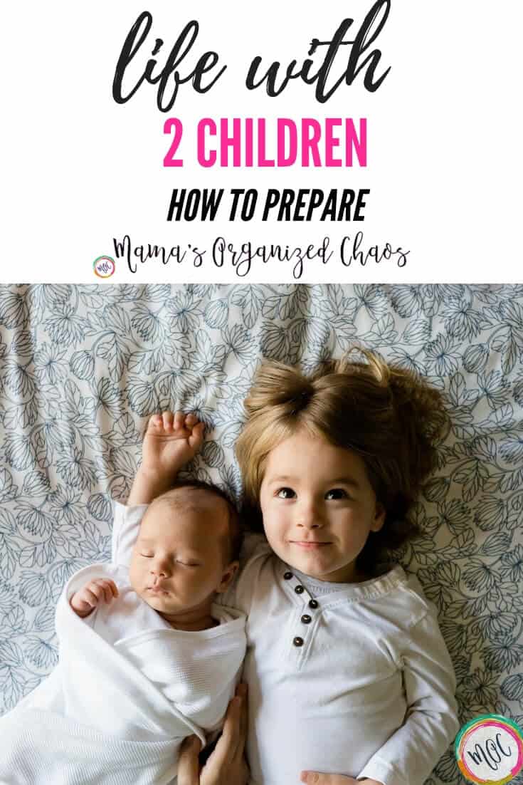 Adjusting to Life with Two Children (Guest Post) life with 2 children- how to prepare. Photo of 2 children snuggling.