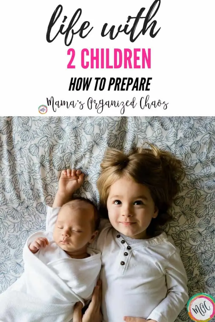 life with 2 children- how to prepare. Photo of 2 children snuggling.