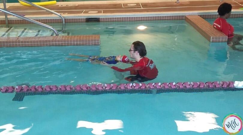 British Swim School- A Girl and Her Goggles Turtle 1 level red cap british swim school learning back stroke