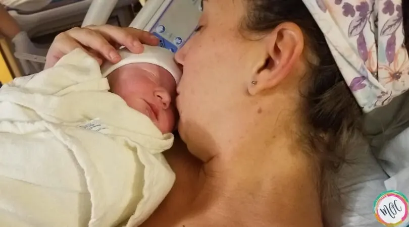 holding baby for the first time before he was taken to the NICU