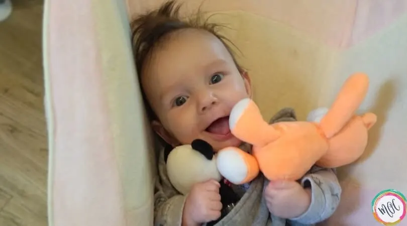 Breastfed Baby Not Gaining Weight happy 4 month old holding lovey