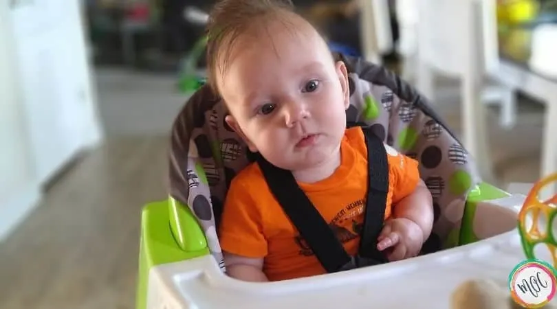 Wonder Weeks Leap 4 baby sitting in highchair