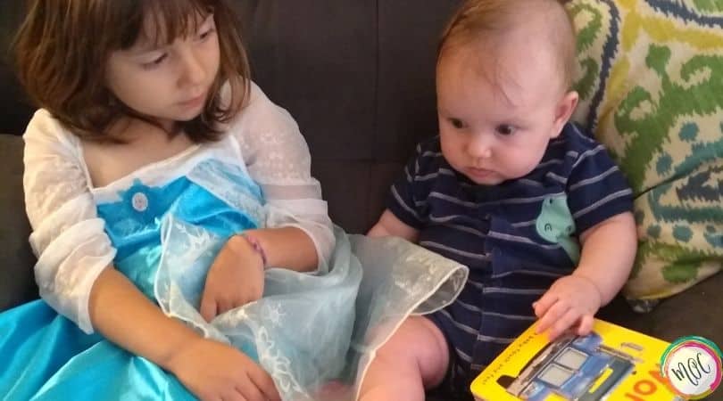 brother and sister sitting together on the couch