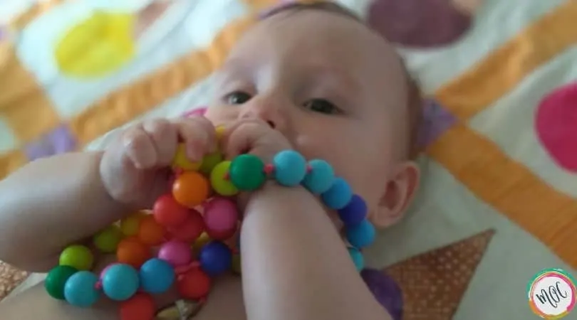 William’s 6 Month Old Schedule 6 month old chewing on teething necklace